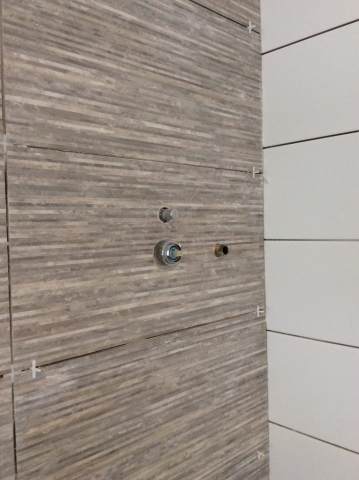 Bathroom tiling in progress